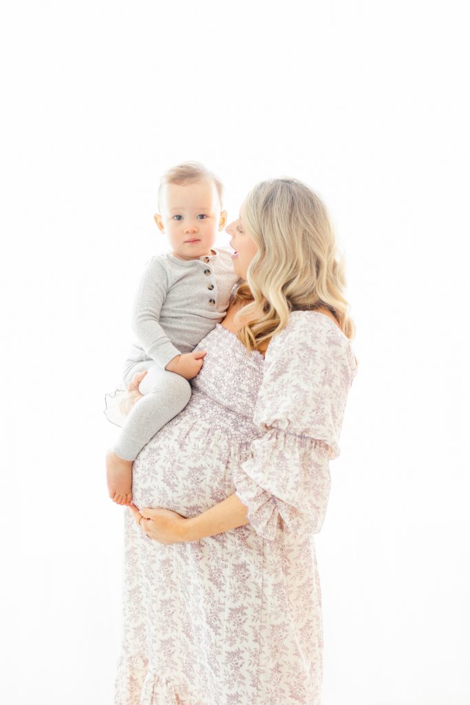 mom holding baby photos