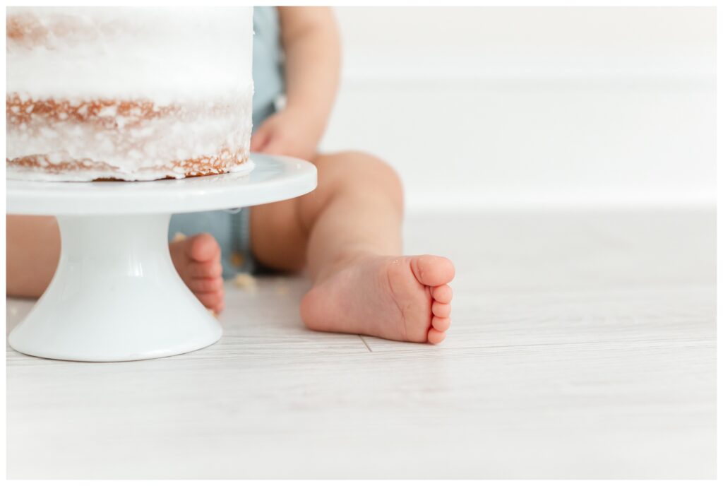 Cute baby toes next to a smash cake by DC Baby Photographer