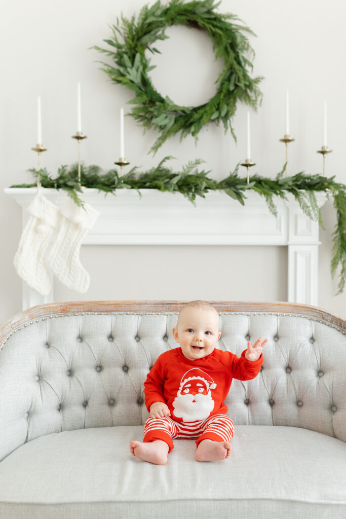 Baby waving at the camera for his Warrenton Santa Pictures