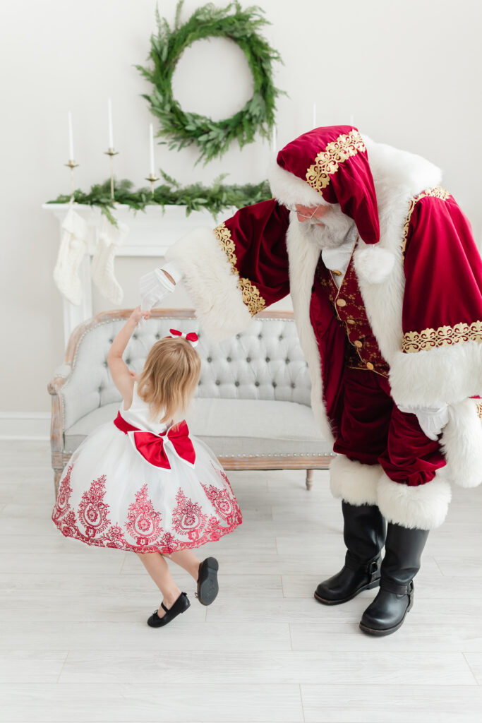 Girl twirling with Santa for her Warrenton VA Santa Pictures