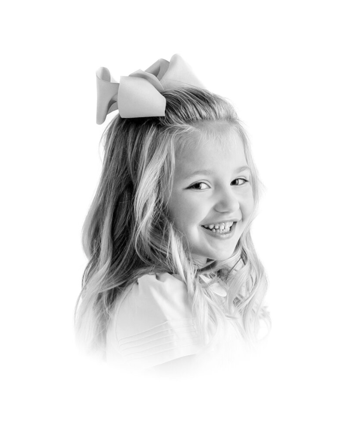 Classic heirloom child portrait in studio with light background