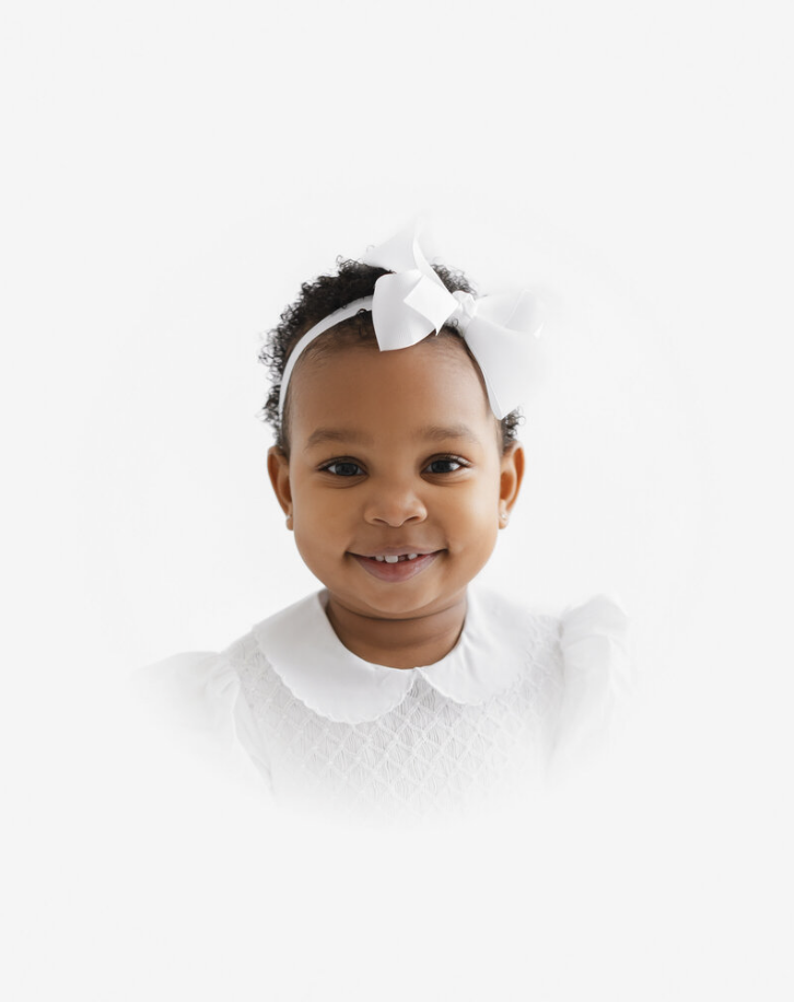 Studio heirloom portrait of sitting baby